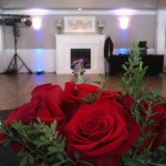 Beautiful bouquet center piece; DJ setup in background